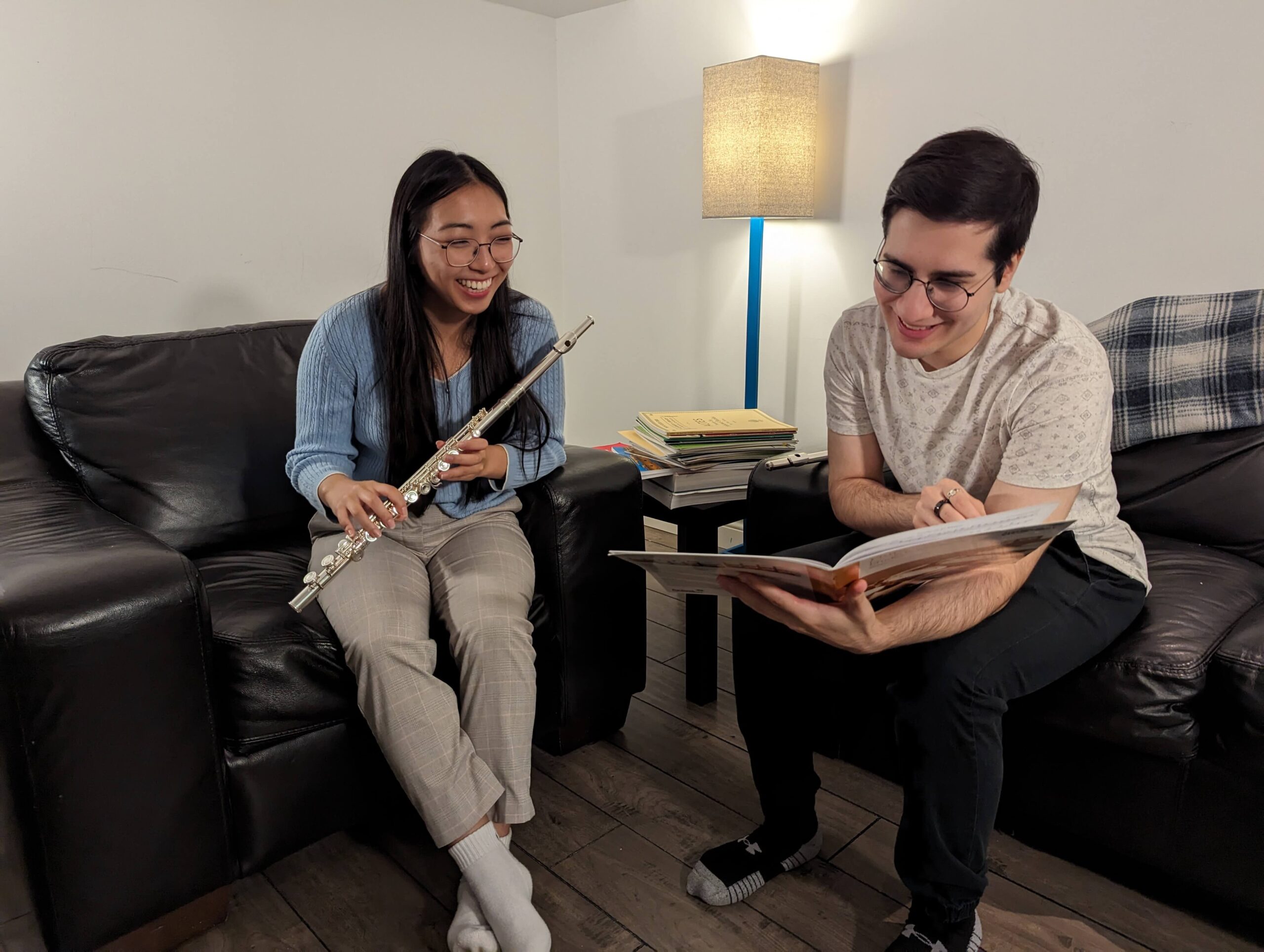 a student learning the flute at a lesson